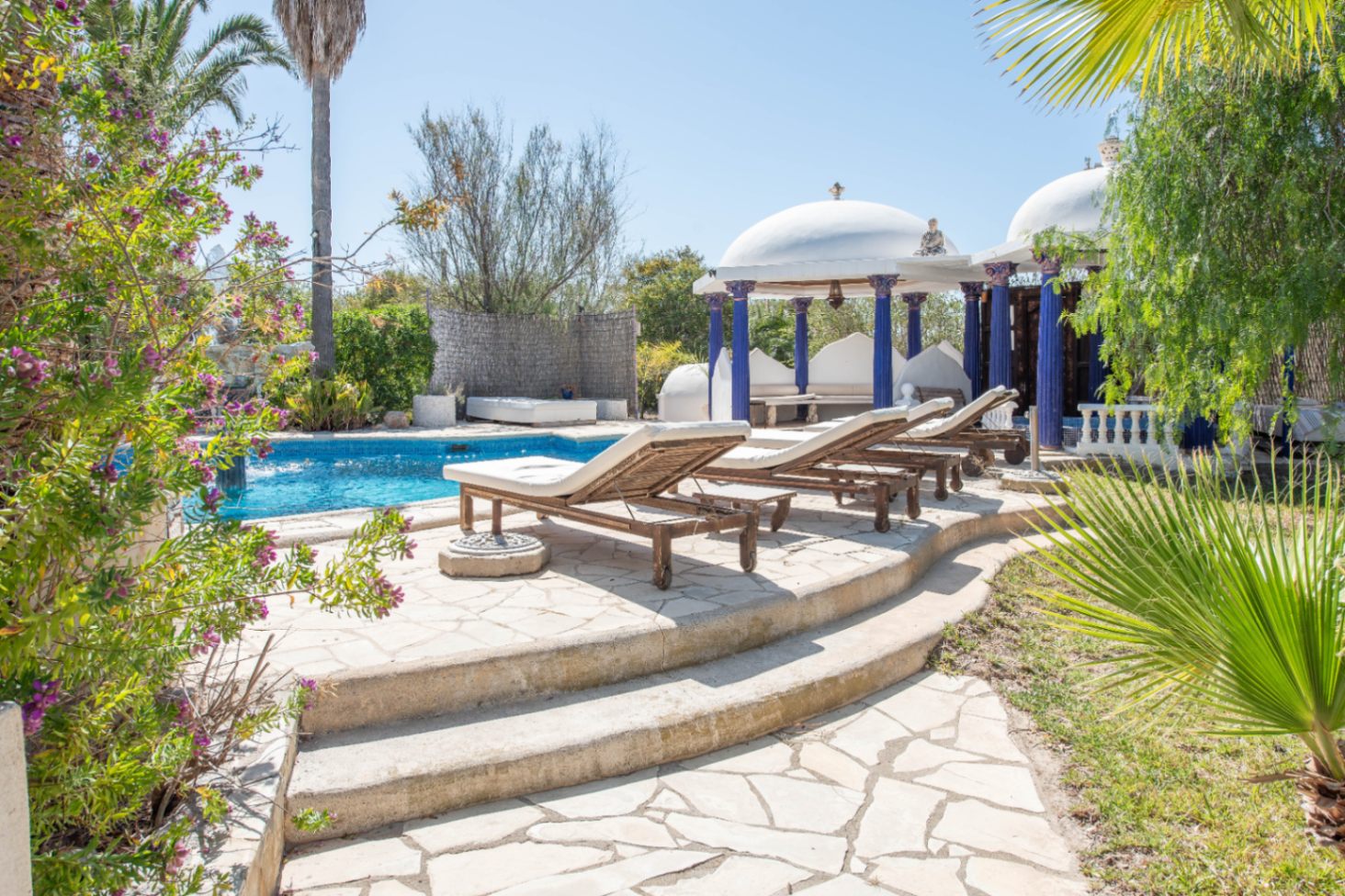 Luxury villa in Ibiza with 6 bedrooms and a modern pool.