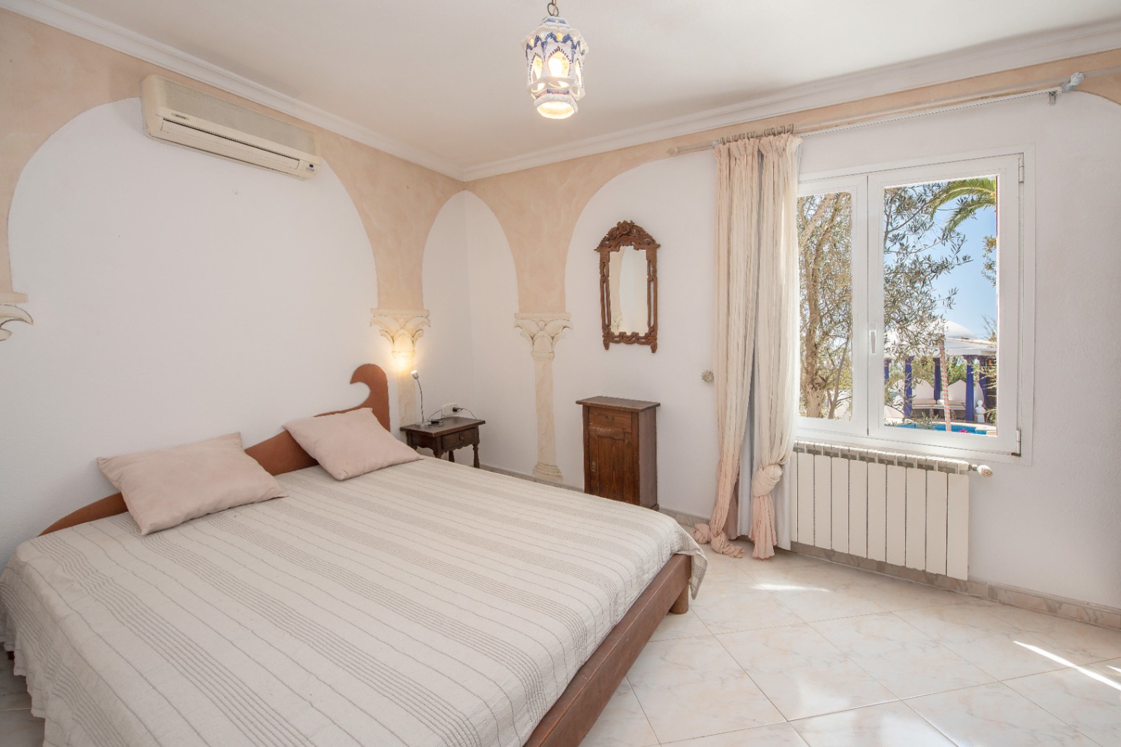 Luxury villa in Ibiza with 6 bedrooms and a modern pool.